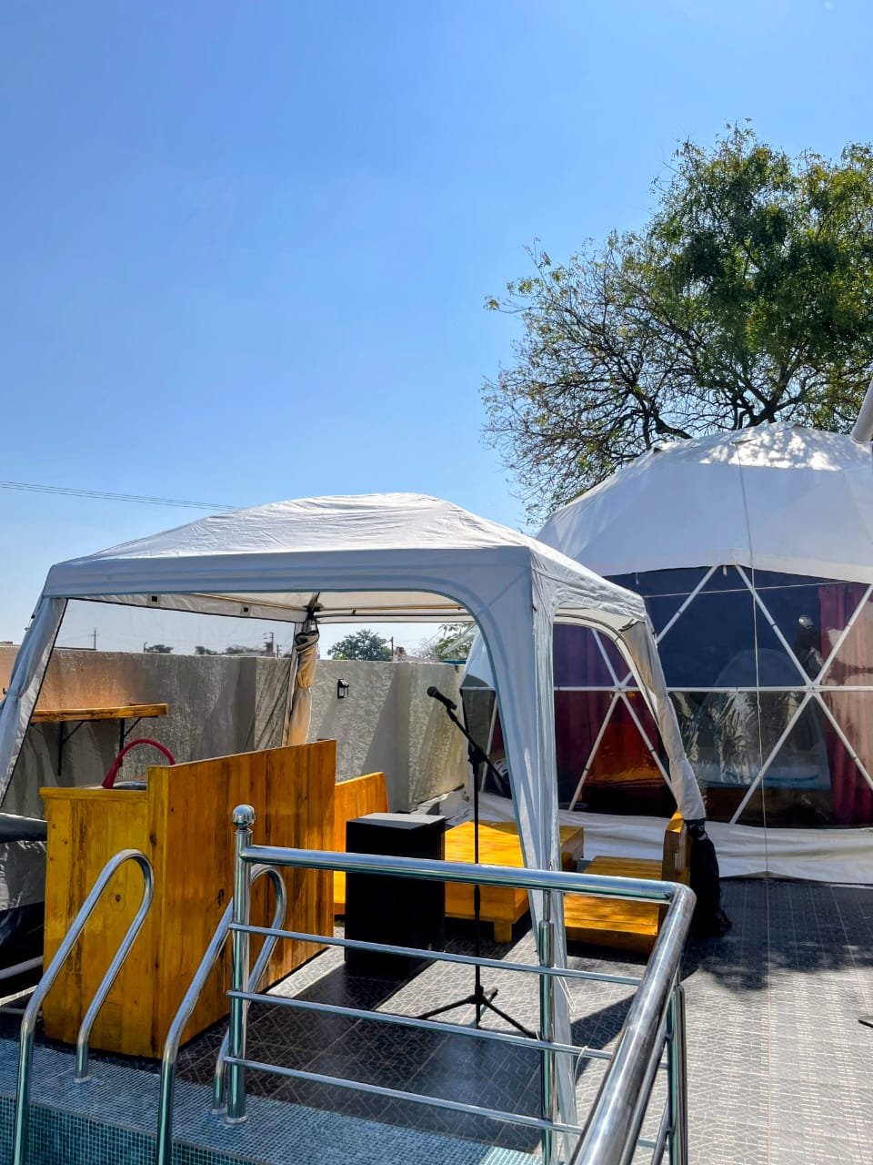 Glass dome with private pool in daylight