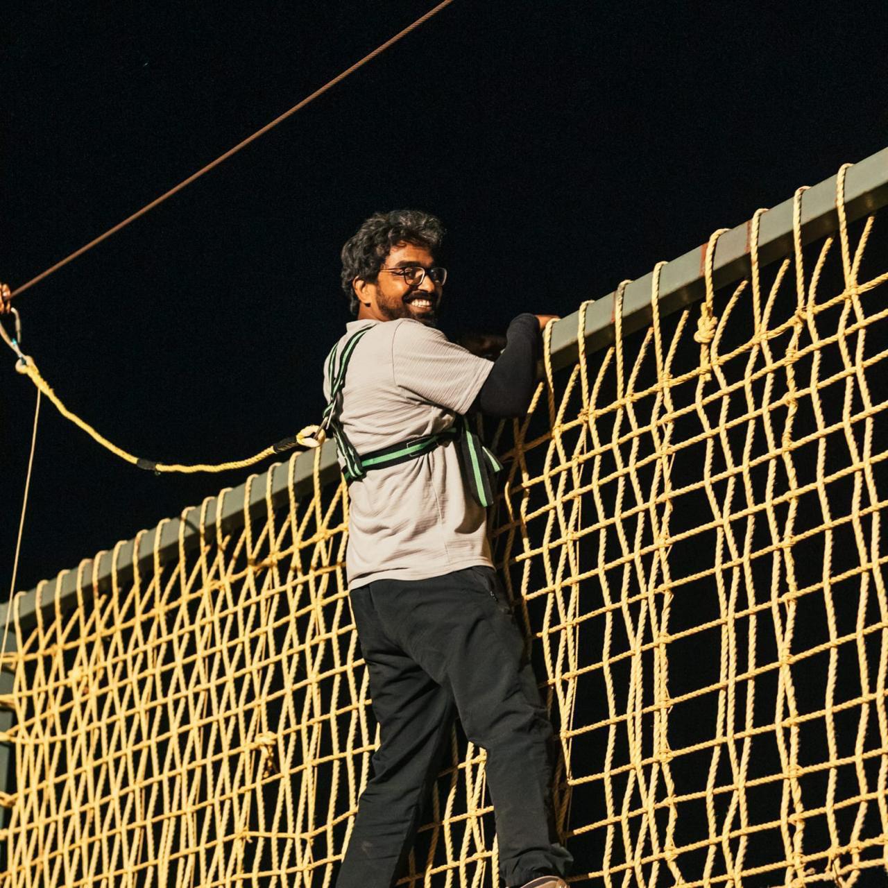 Guest on a night rope-climbing adventure